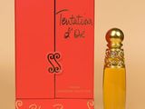 an orange box with a small bottle of perfume next to it