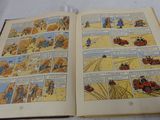 an open comic book with a picture of a man driving a car