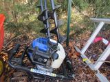 a small machine that is sitting on the ground in the woods