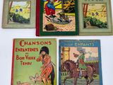 four children ' s books are lined up on a white surface