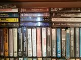 a lot of dvds on the shelf in the room