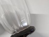 two wine glasses that are on the wall next to each other