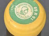 a yellow and green jar with a label on it