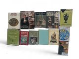 a lot of books that are sitting on a table