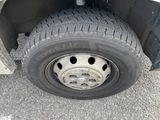 a close up of a flat tire on a truck