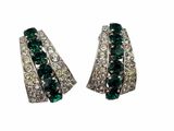 a pair of emerald and white diamond earrings