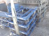 a pile of metal crates stacked on top of each other