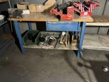 a workbench with tools on top of it in a garage