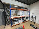 a room that has a lot of shelves in it