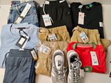 several pairs of men ' s clothing are laid out on a table