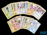 a lot of pokemon cards that are on the table