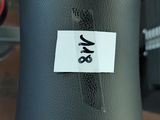 a close up of a traffic light with a sticker on it