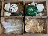 three boxes with different items in them sitting on the floor