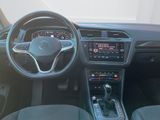 the interior of a car with a steering wheel, dashboard, and dashboard controls