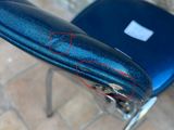 a blue chair with a black seat and a red line on the seat