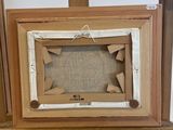 a picture of a wooden frame with a picture in it