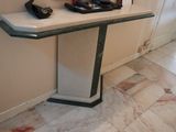 a table with a phone on it in a room