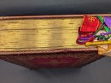 a book with a bunch of ribbons on top of it