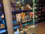 a glass display case in the middle of a store