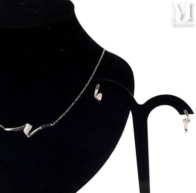necklace and earring set on a mannequin display stand