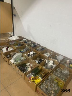 many boxes of assorted items sitting on the floor