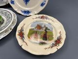 a lot of plates that are sitting on a table
