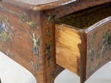 a small wooden table with a drawer underneath it