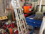 a ladder that is leaning against a wall in a garage