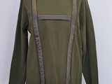 olive green turtle neck sweater with brown leather suspenders on mannequin base