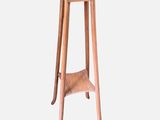 a small wooden table with a marble top on it