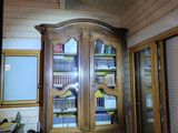 a large wooden cabinet in the corner of a room