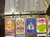 a suitcase full of cards and other items on the floor