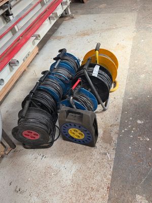 many different types of hoses sitting on the ground