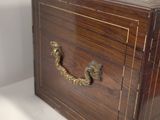 a small wooden box with a handle on it