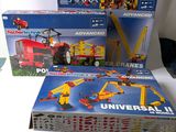 three boxes of legos sitting on a table