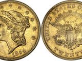 a gold coin with a woman ' s head and a crown on it