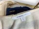 a close up of a white shirt with a label on it