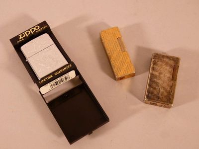 a lighter and a lighter case sitting on a table