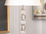 a lamp that is sitting on a table in a room