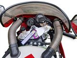 a close up of a motorcycle ' s engine and dashboard