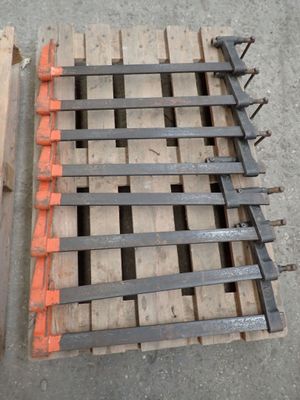 a wooden pallet with a bunch of nails on top of it