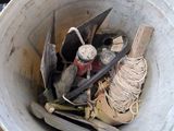 a bucket full of tools sitting on top of a table