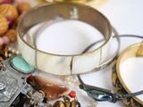 many different bracelets and bracelets on a table