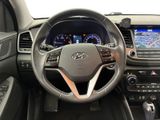 the interior of a car with a steering wheel and dashboard controls