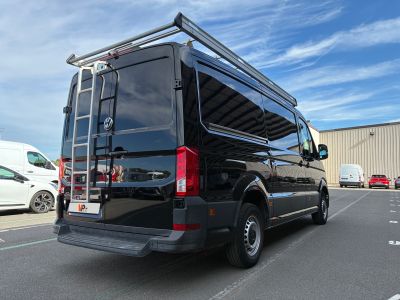 a black van that is parked in a parking lot