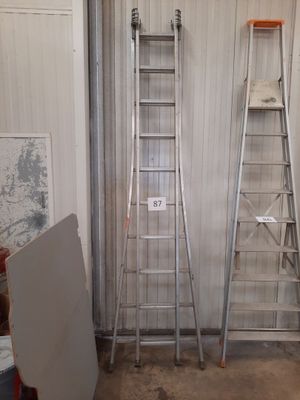 two ladders that are next to each other in a room