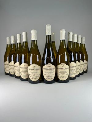 six bottles of wine are lined up in a row on a table