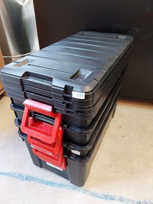a black case with a red handle on top of it
