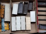 a box full of different types of train cars in it
