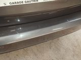 a close up of the bumper of a car with a sticker that says garage gautrin